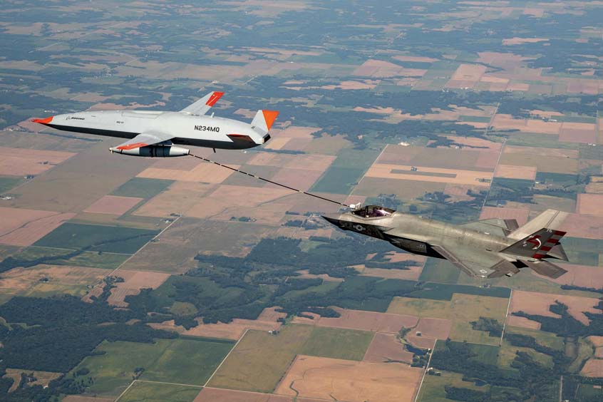 Boeing’s MQ-25 T1 test asset transfers fuel to a U.S. Navy F-35C Lightning II fighter jet Sept. 13 during a flight-test mission. (Photo: Kevin Flynn)
