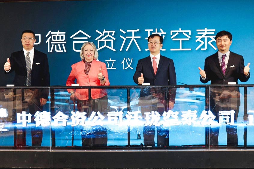 Volocopter announces a joint venture with Geely's Aerofugia. Officials pressing the launch mechanism on stage to officiate the set-up of JV. Left to right: Jing chao, Chairman of Volocopter Chengdu, Ingrid Delfs Consul of the German Consulate General in Chengdu, Xu Zhihao, CEO of Geely Technology Group, Guo Liang, CEO of Volocopter Chengdu. (Photo: Volocopter Chengdu Technology Co. LTD)