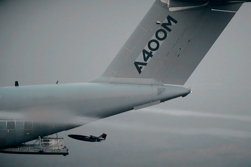 An A400M deploys a drone from its opened rear cargo ramp door whilst airborne, validating its ability to air-launch drones. (Photo: Airbus)