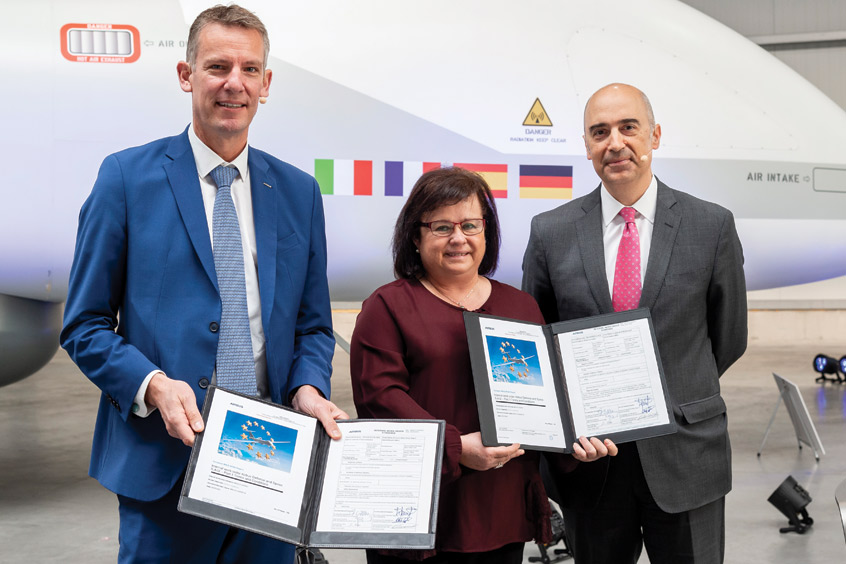 Jean-Brice Dumont (Airbus DS), Covadonga Corrales (Airbus DS SAU) and Paco Sánchez Segura (Airbus DS SAU) sign the Eurodrone global contract. (Photo: Airbus)