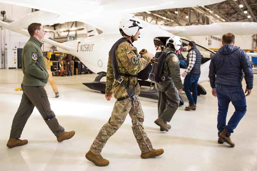 U.S. Air Force and BETA Technologies team members walk toward an ALIA aircraft for a flight test. (Photo: BETA Technologies, Brian Jenkins)