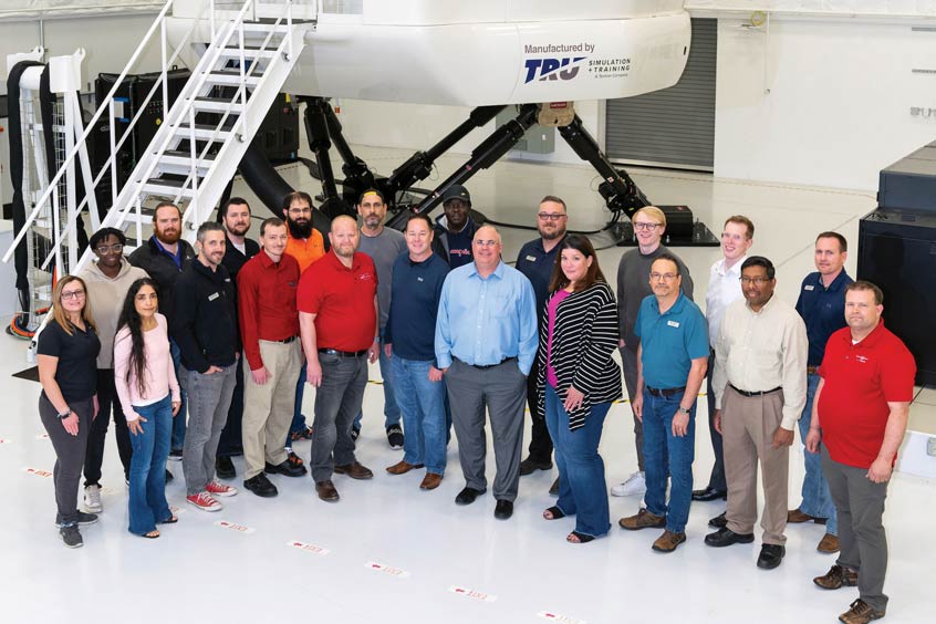 Let the training commence: The TRU crew mark the certification of the SkyCourier simulator.