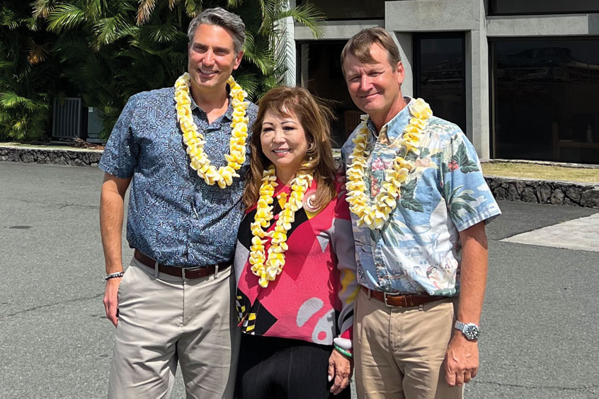 Ross Aviation CEO Brian Corbett with Air Service Hawaii vice president of marketing and sales Mi Kosasa and president Shaen Tarter.