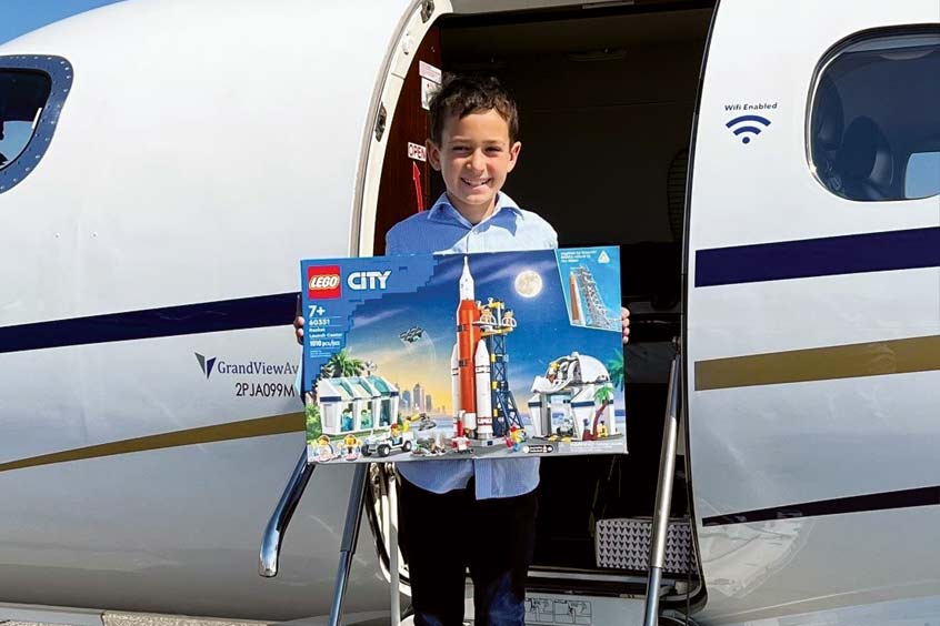 Nine-year-old Guy was treated to LEGO on his return trip after cancer treatment in New York City.