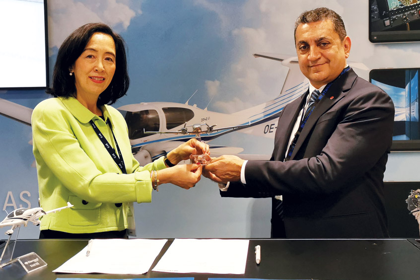 Diamond Aircraft Austria sales director Jane Wang and Urbe Aero Flight Academy accountable manager Lorenzo Mezzadri sign the contract for eight brand new Diamond training aircraft.
