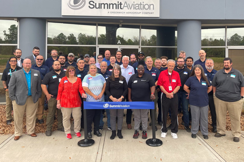 The Summit team celebrates its extensive new facility.
