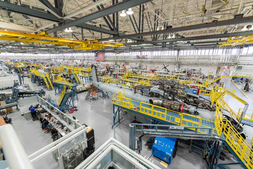 Sikorsky employees build CH-53K aircraft using 3-D work instructions, new titanium machining centres with multi-floor ergonomic platforms.