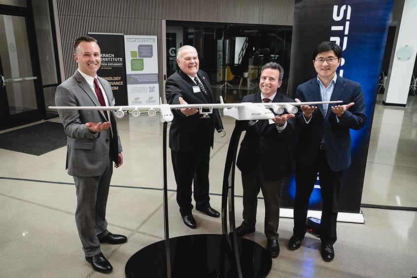 From left are Stratolaunch CEO and president Zachary Krevor, U.S. Rep. Jim Baird of Indiana and Purdue’s Dan DeLaurentis and President Mung Chiang.