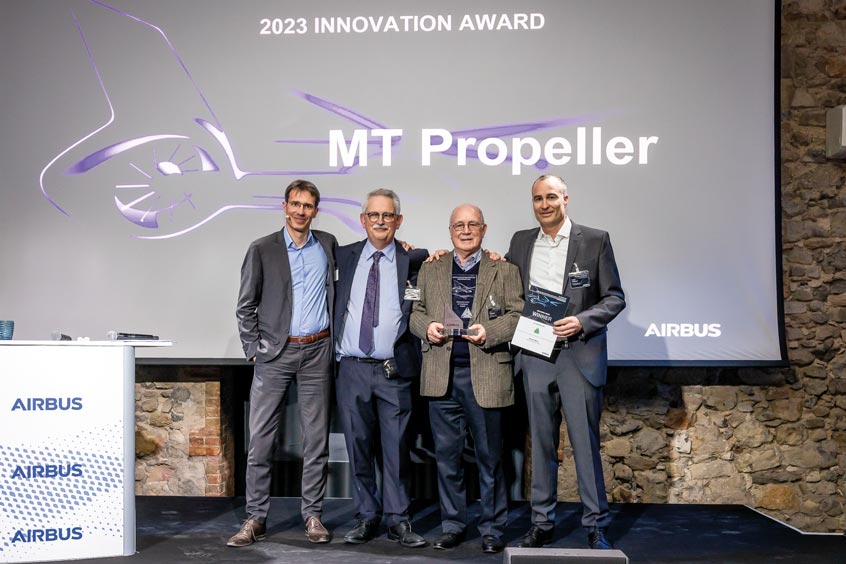 On stage, from left to right, Antoine Baux (Chief Procurement Officer Airbus), Dr. Tomasz Krysinski (Head of Research and Innovation Airbus), Gerd Mühlbauer (President and Founder MT-Propeller), Martin Albrecht (Vice President, General Manager MT-Propeller).