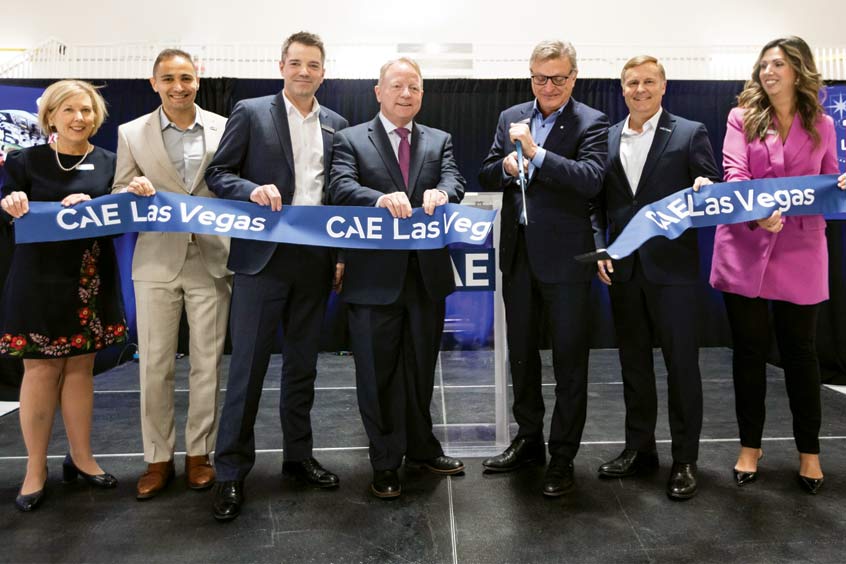 At the official ribbon cutting for the  April 4, 2023 inauguration of CAE Las Vegas business aviation training centre are: Clare Doherty - Director, Government Relations & Washington Operations, CAE; Ash Zare, Las Vegas Center Leader, CAE; Alexandre Prevost, VP Business Aviation and Helicopter Training, CAE; Tom Burns, Executive Director of the Nevada Governor's Office of Economic Development; Marc Parent, Chief Executive Officer, CAE; Chris Rocheleau, Chief Operating Officer, NBAA; and Samantha Golinski, Vice President – Public Affairs & Global Communications, CAE.