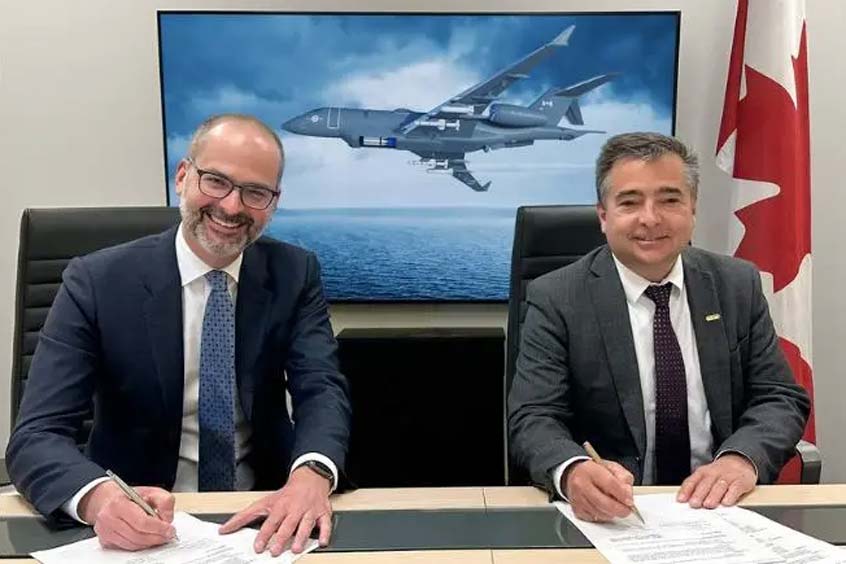 Jean-Christophe Gallagher (left), Executive Vice-President, Aircraft Sales and Bombardier Defense, and Joel Houde, Vice President and General Manager, General Dynamics Mission Systems–International, signing a Memorandum of Understanding