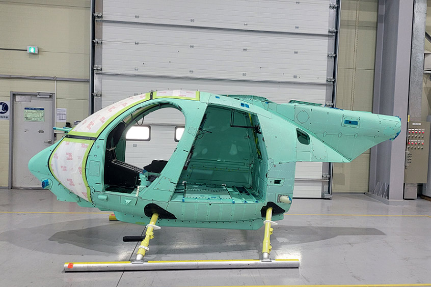Green and ready to go, the first AH-6 fuselage made in South Korea.