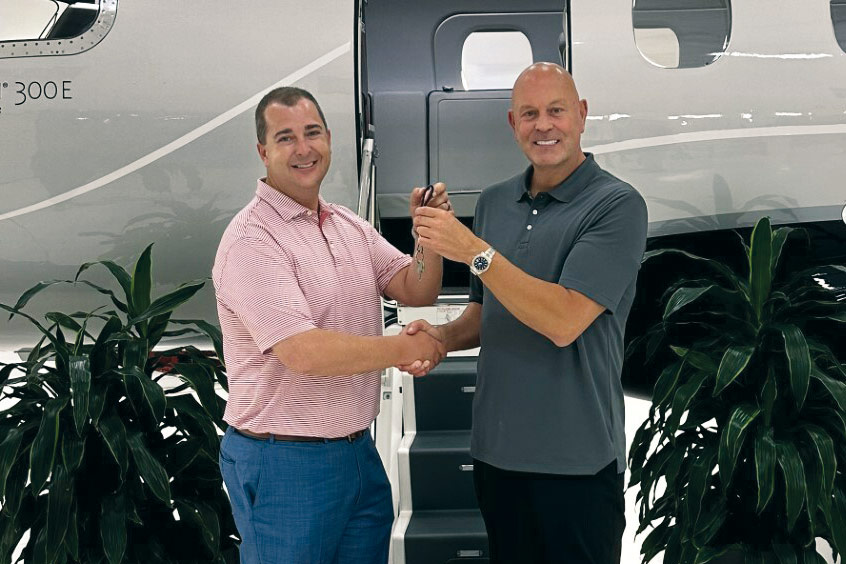 Rickey Oswald and Christopher Munday take delivery of N111CM.