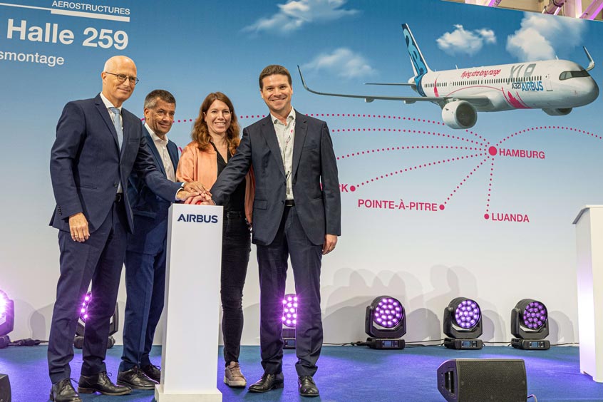 Peter Tschentscher, First Mayor of the Free and Hanseatic City of Hamburg, André Walter, Head of Airbus Commercial Aircraft Production in Germany, Anna Christmann, Federal Government Coordinator of German Aerospace Policy and Gary O'Donnell, Head of A321XLR Development, open the new A321XLR Equipment Installation Hangar in Hamburg, designed and constructed in line with latest production and sustainability standards.