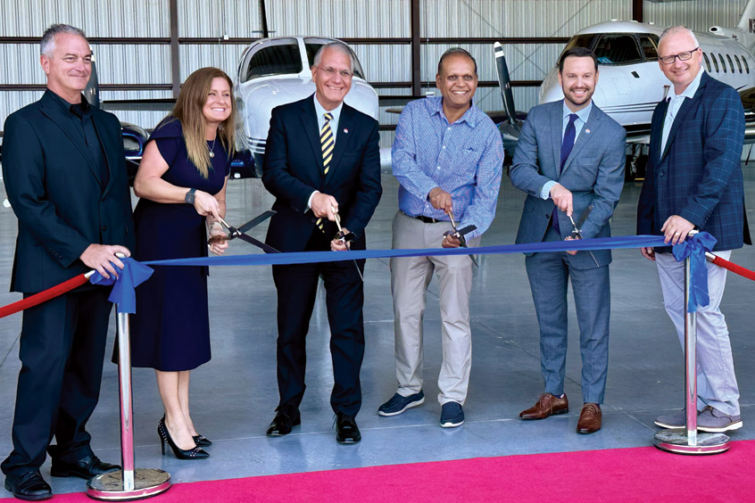 Officials from the Hillsborough County Aviation Authority, Tampa International airport and Skyport Aviation celebrate the grand opening of the new hangar.