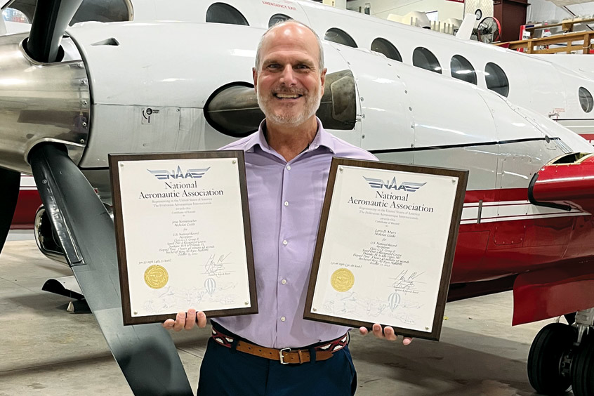 Tamarack founder and CEO, and co-pilot on the record-breaking flights, Nick Guida with the NAA and FAI certificates.