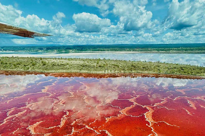Scenic Air flies over Lake Magadi, a shallow, alkaline lake located in the Great Rift Valley of Kenya.