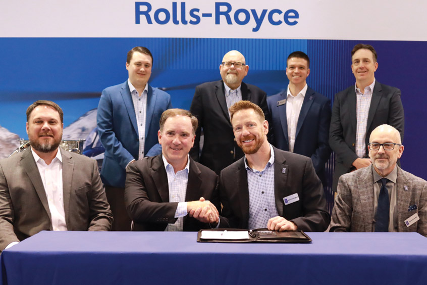 PHI MRO and Rolls-Royce executives shake on the AMC approval.