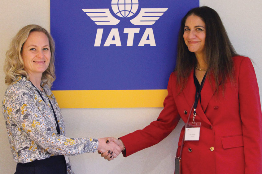 Kate Harbosin, business development, business transformation & aftermarket services, Pratt & Whitney Canada and Puja Mahajan, CEO Azzera, seal the deal with a handshake.