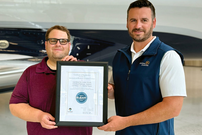 Sonoma Aviation safety manager Josh Foster and vice president Clayton Lackey present their IS-BAH Stage 3 certification.