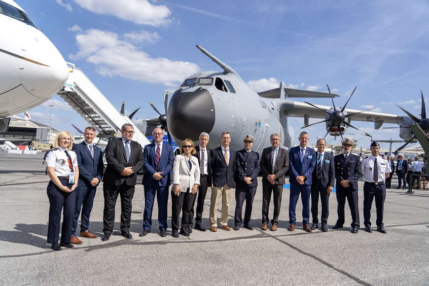 Airbus and OCCAR representatives celebrate the agreement at the Airbus static at Paris Airshow 2025.