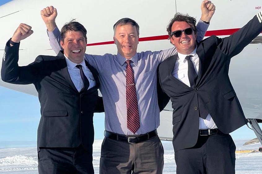 The ACASS-operated Falcon 8X crew and San Marino inspector on the ice runway at Wolf’s Fang, Antarctica, following the aircraft’s first landing on the continent.