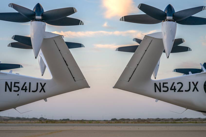Two of Joby’s electric air taxis at its flight test and manufacturing facilities in Marina, CA.