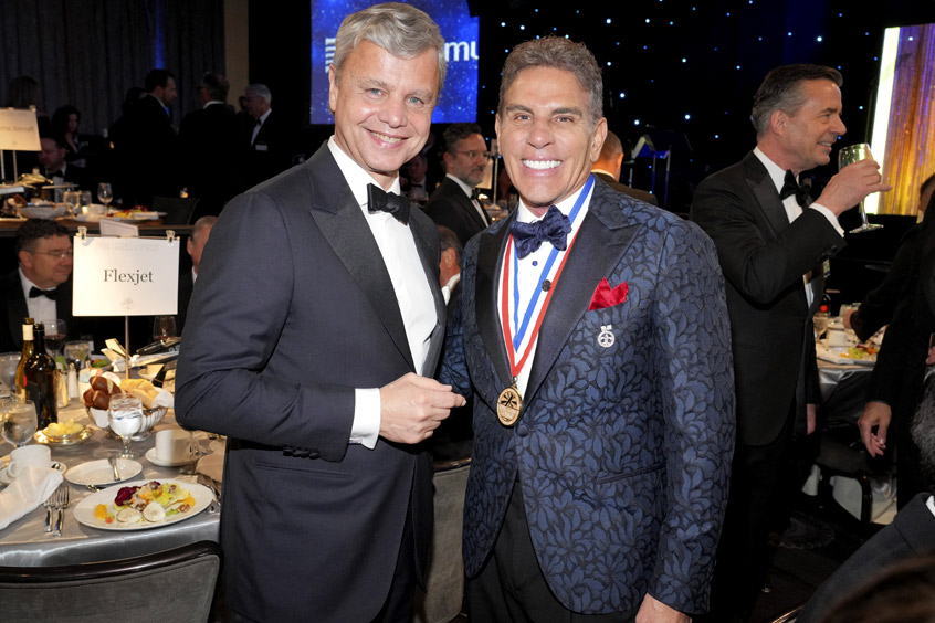 George A. Antoniadis receives the award from Kenn Ricci.