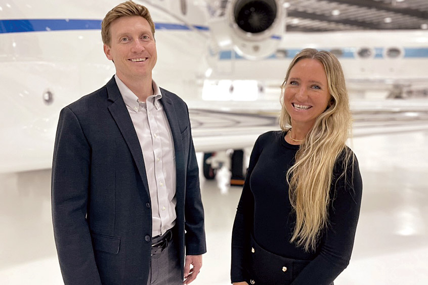 Latitude 33 director of charter Jesse Cunningham and charter sales lead Megan Fry with one of Latitude 33 Aviation’s five West Coast Bombardier Challengers.