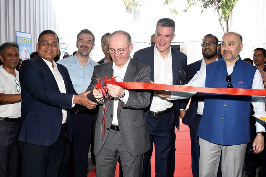 Proud moment: Martin Wandel, Managing Director and Chief Operating Officer, Liebherr-Aerospace & Transportation SAS (center), had the honor of cutting the ribbon together with Amit Kalyani, Vice Chairman & Joint Managing Director, Bharat Forge (right) and Guru Biswal, Aerospace CEO, Bharat Forge Ltd. (second from left).