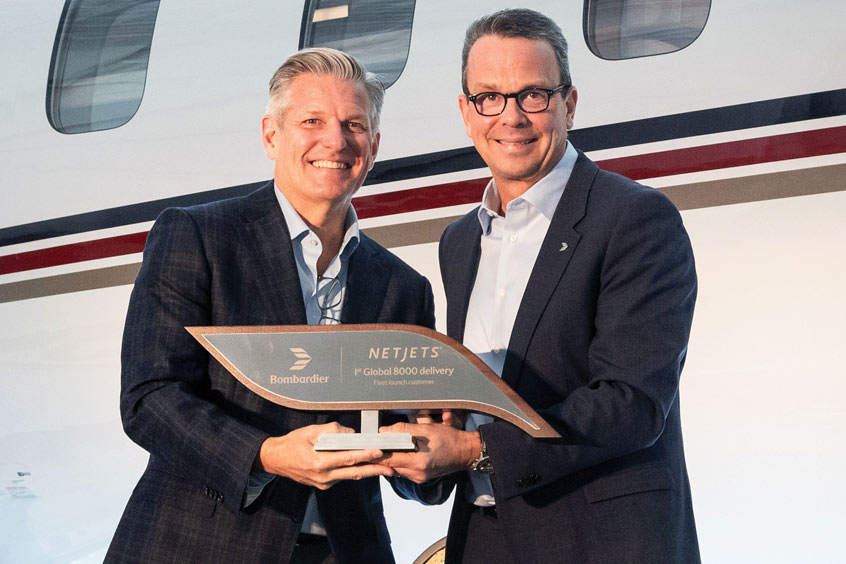 NetJets’ Patrick Gallagher and Bombardier’s David Murray celebrate the delivery of NetJets’ first Global 8000 business jet.