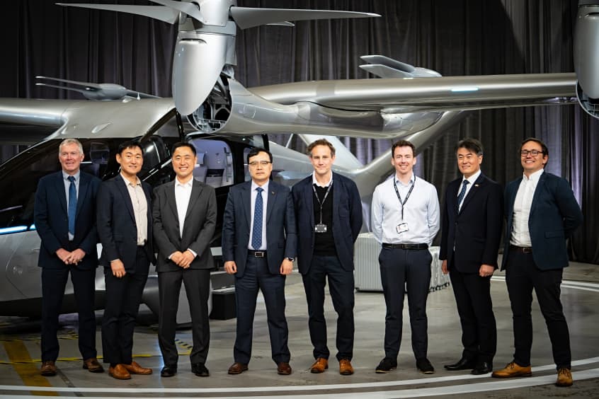 Ho-Young Lee, Vice President of Hyundai WIA (centre-left), with members of the Hyundai WIA and Vertical Aerospace teams in front of Valo.