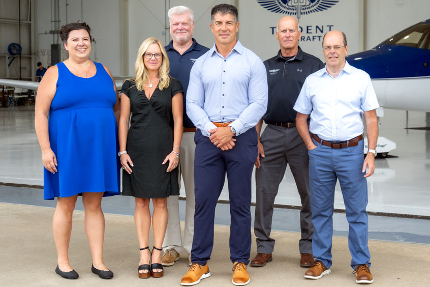Flight ops manager Nicole Midyett, HR manager Melody Melvin, CFO Tad Woodward, founder and president John Galdieri, captain Frank Fluharty and chief pilot David Midyett.