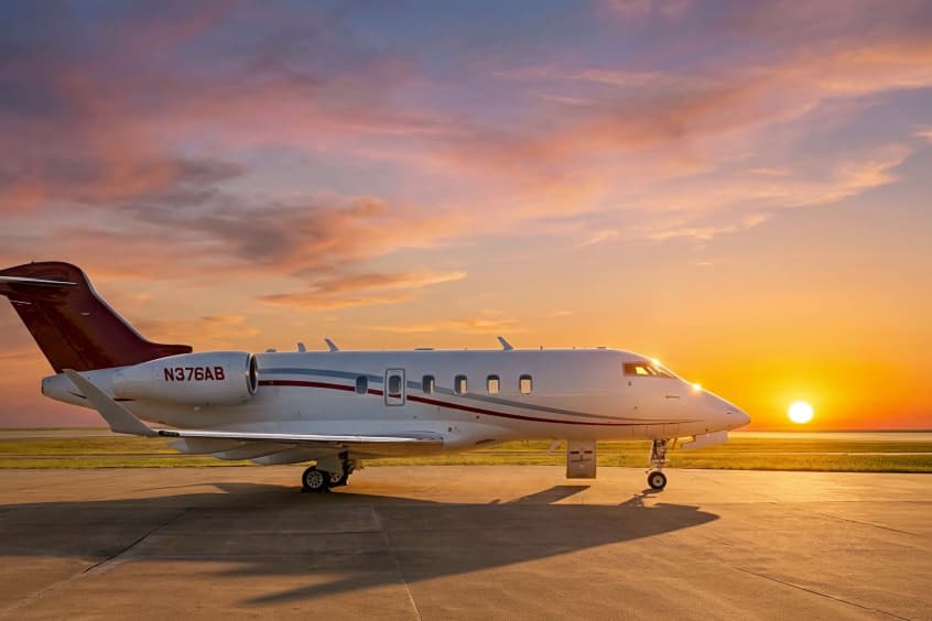 The aircraft catches the sunset light.