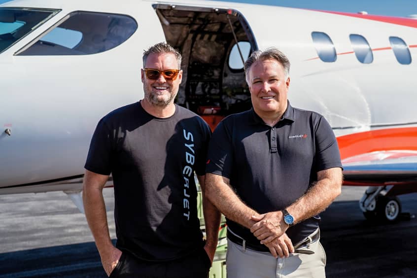SyberJet CEO Trevor Milton and pilot Gordy Bryan in front of the record-setting SJ30-2 following the transcontinental flight.