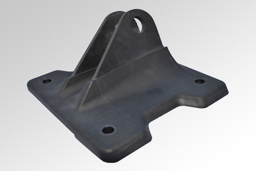 A hybrid overmoulded aircraft cabin bracket made of VICTREX AE 250 carbon fibre PAEK composite and VICTREX PEEK polymer.