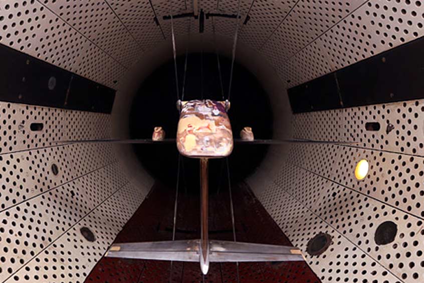 A model of the Il-112V light military transport aircraft undergoes wind tunnel testing.